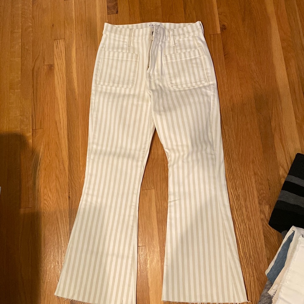 Frame Denim. Skinny and flare at bottom beige and white striped jeans. Size 26
